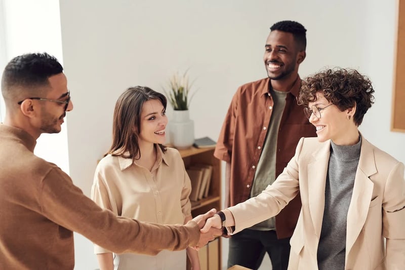 Group of people welcoming new member