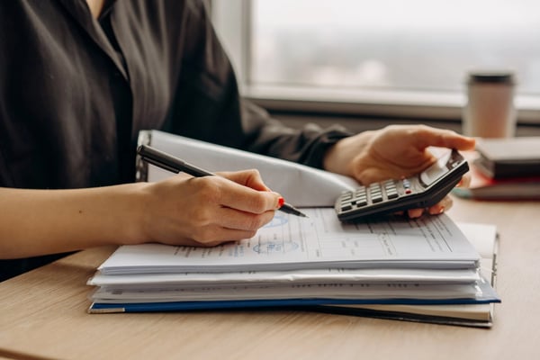 Person calculating costs
